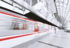 blurred motion of illuminated railroad station in city